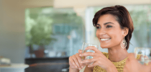 lady holding a glass of water