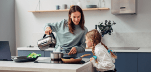 Mum with daughter in the kitchen with a boiler