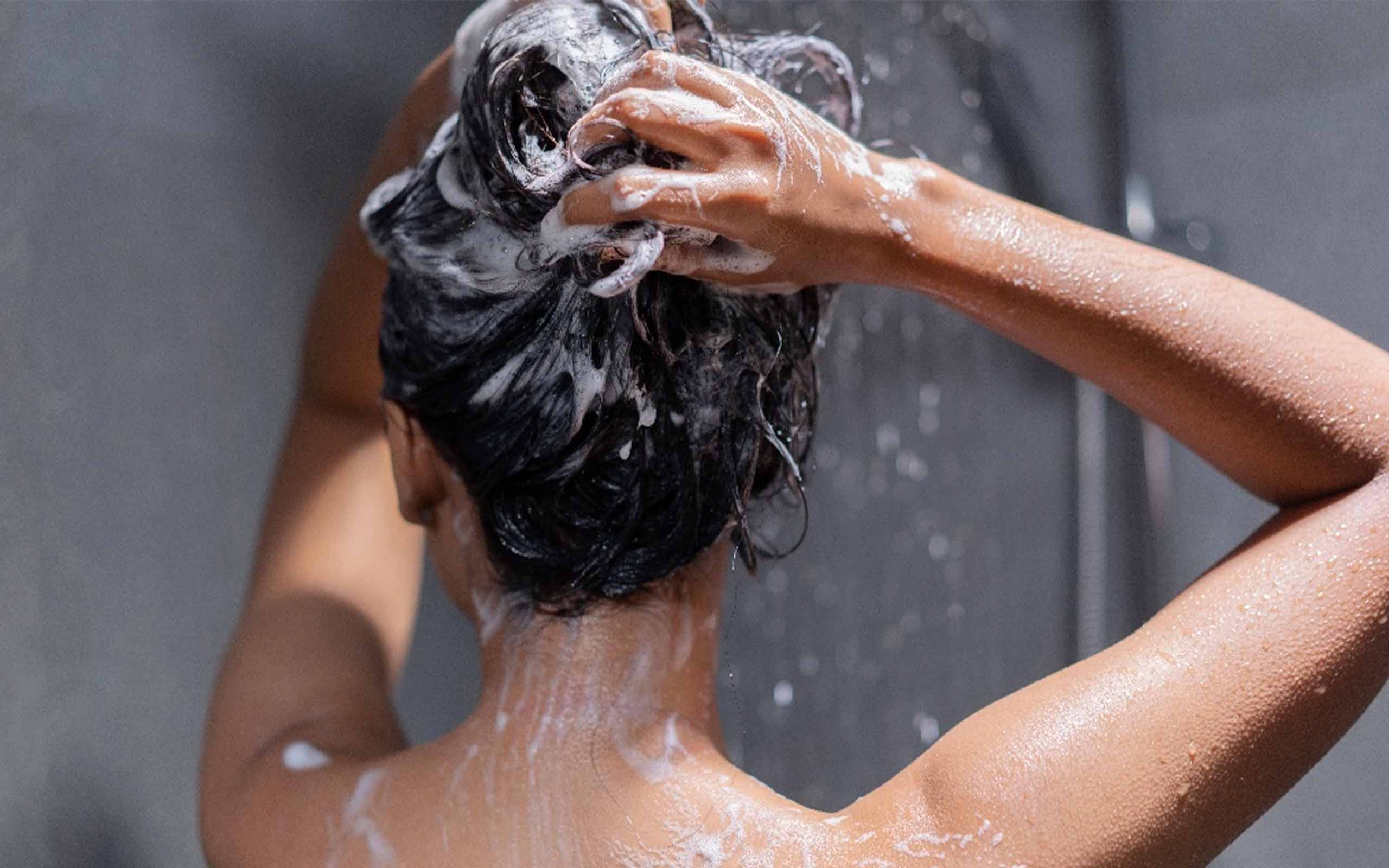 woman washing hair in the shower