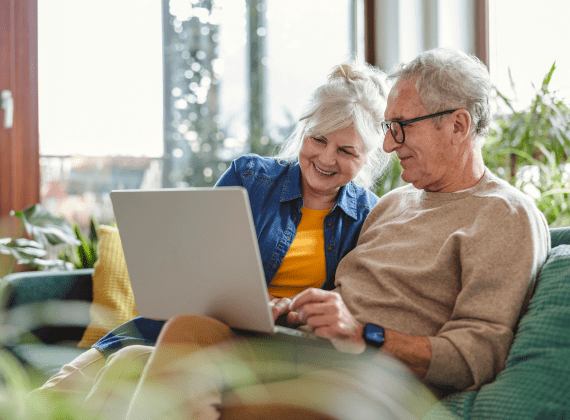 looking-ahead-two-elderly-people-on-laptop