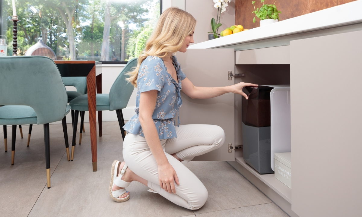 Lady using her harvey water softener